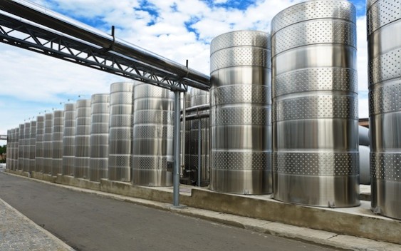Those huge tanks are for fermentation, and help maintain a healthy temperature for the yeast.